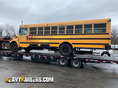 school bus skid steer hauler|high school bus transportation.